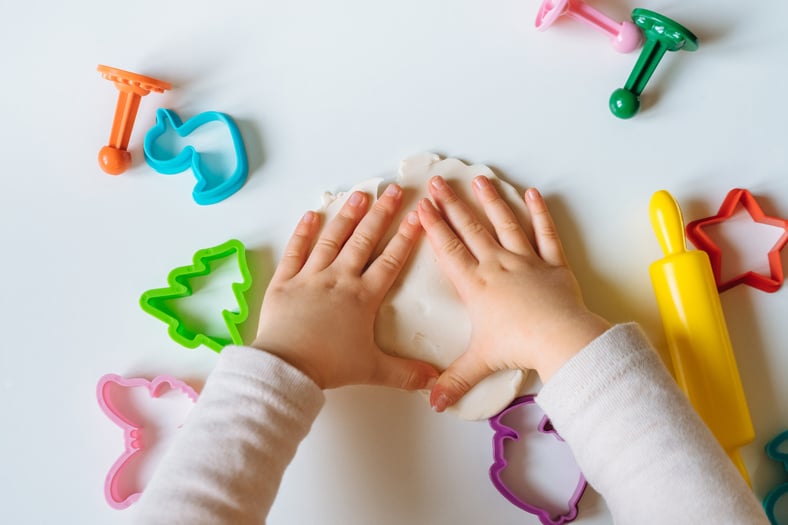  Child's Hands Playing with Homemade Playdough. 